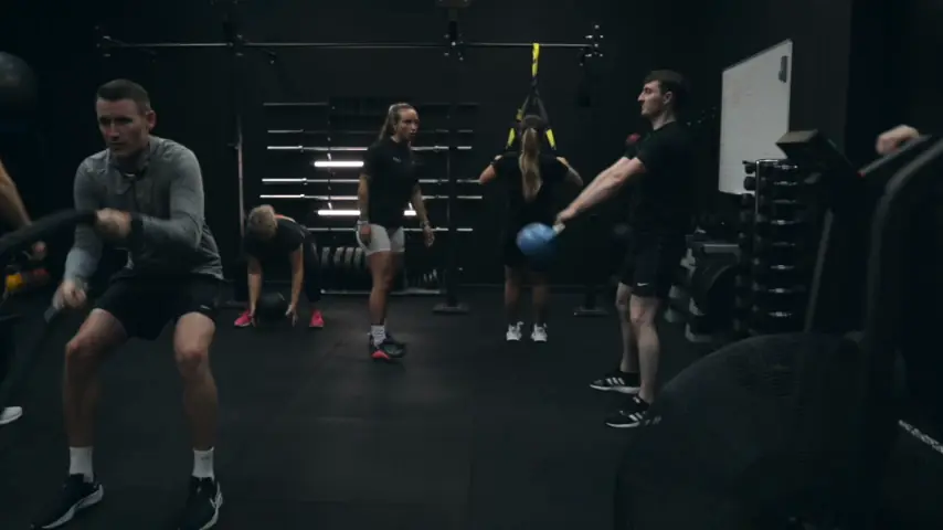 A fitness class in progress on the gym floor